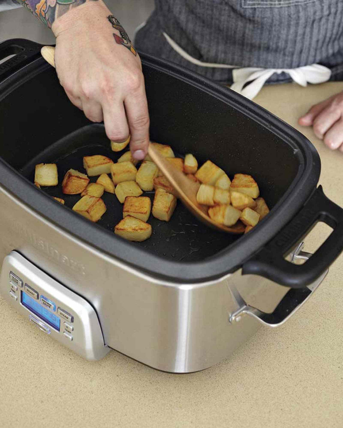 Cuisinart MSC-800 7-quart stainless steel multicooker with programmable slow cook, roast, sauté, and steam functions and blue backlit LCD display