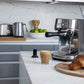 Breville Bambino Plus espresso machine in brushed stainless steel with compact design and automatic frothing features