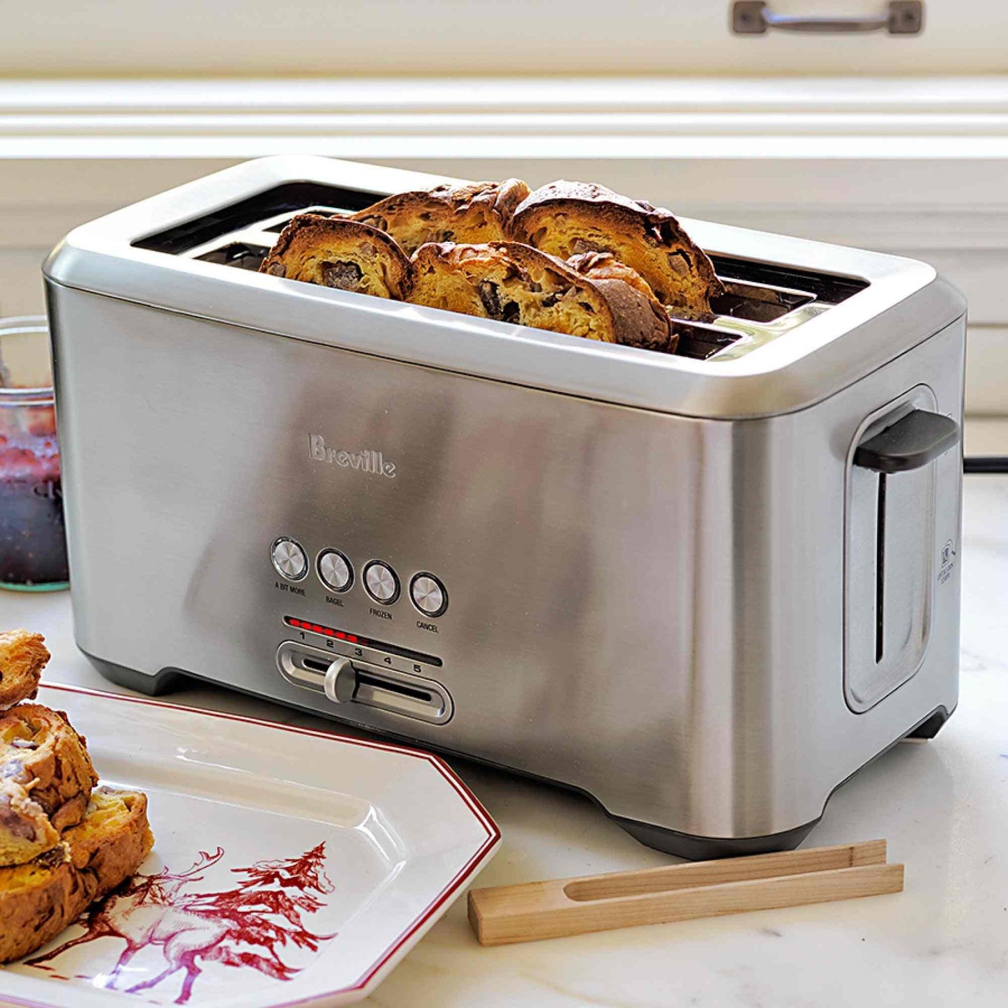 Breville Bit More 4-slice toaster in brushed stainless steel with LED progress indicator and long slots.