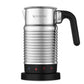 Nespresso Aeroccino 4 silver electric milk frother with ergonomic handle and chrome jug on kitchen counter