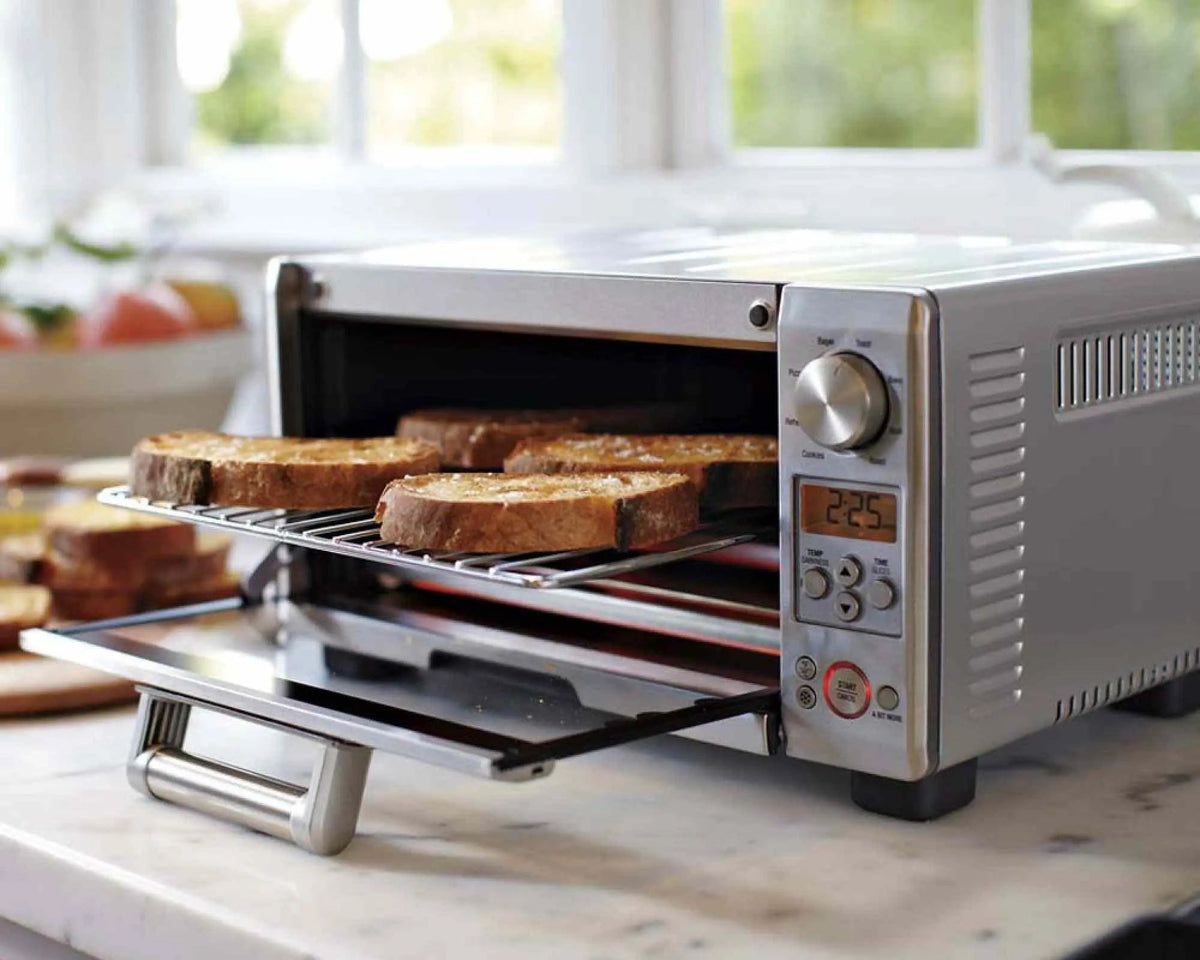 Breville Mini Smart Oven BOV450XL brushed stainless steel countertop toaster oven with Element iQ system and 8 cooking functions