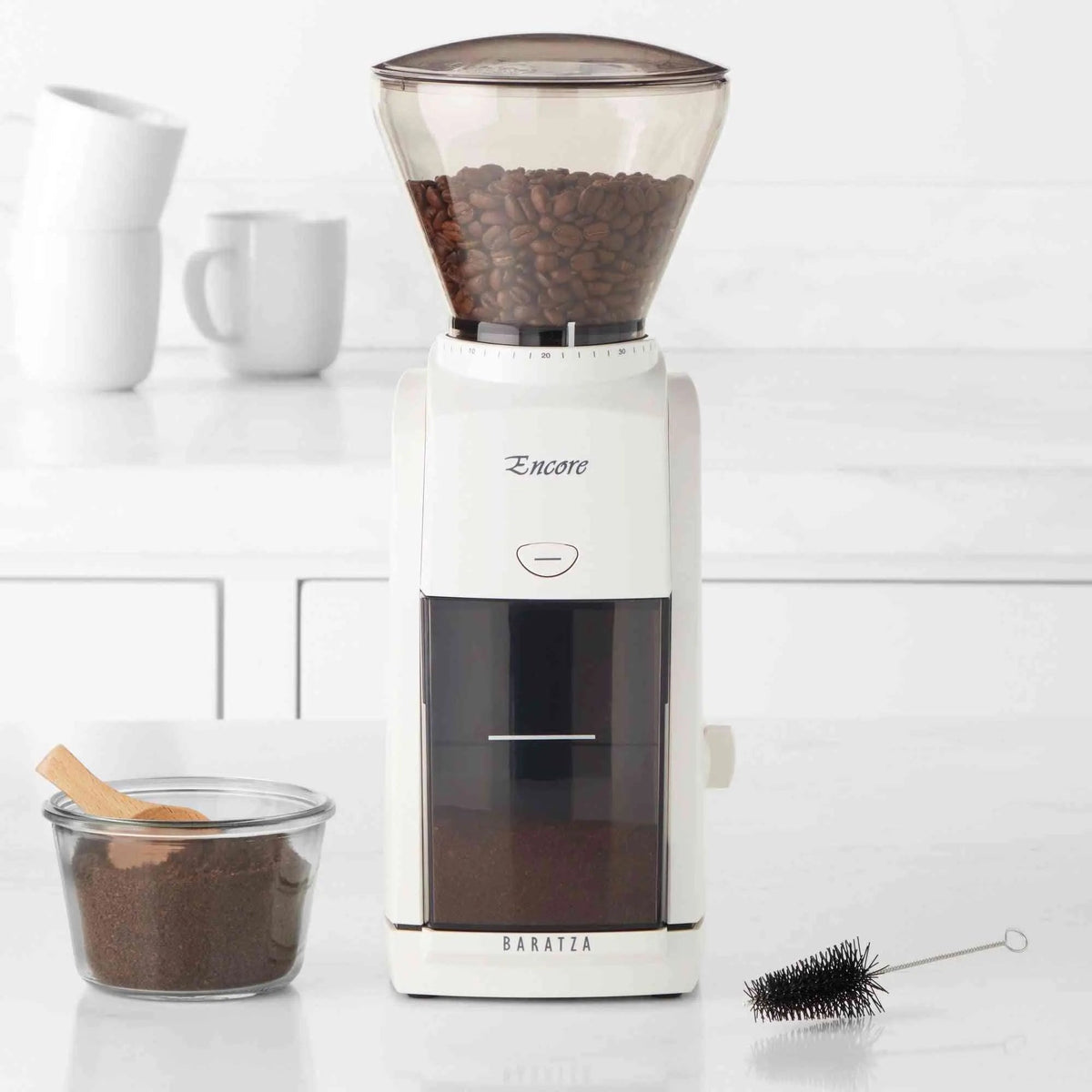 Baratza Encore Conical Burr Coffee Grinder with 40 grind settings and clear grinds bin in kitchen setting