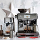 Breville Bambino Plus espresso machine in brushed stainless steel with compact design and advanced brewing features