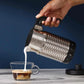 Nespresso Aeroccino 4 silver electric milk frother with ergonomic handle and sleek design on countertop