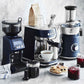 Breville Bambino Plus espresso machine in brushed stainless steel with compact design and automatic microfoam texturing