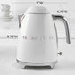 SMEG Electric Kettle with 360° swivel base, auto-shutoff, water-level indicators, gentle steam release, and removable limescale filter