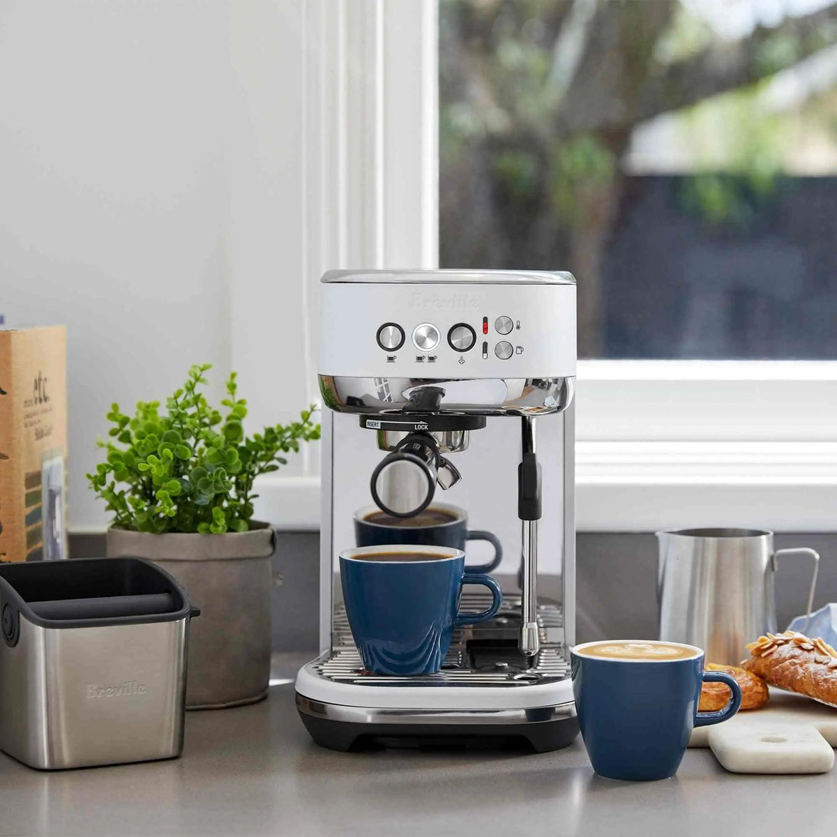 Breville Bambino Plus espresso machine with brushed stainless steel finish and compact design