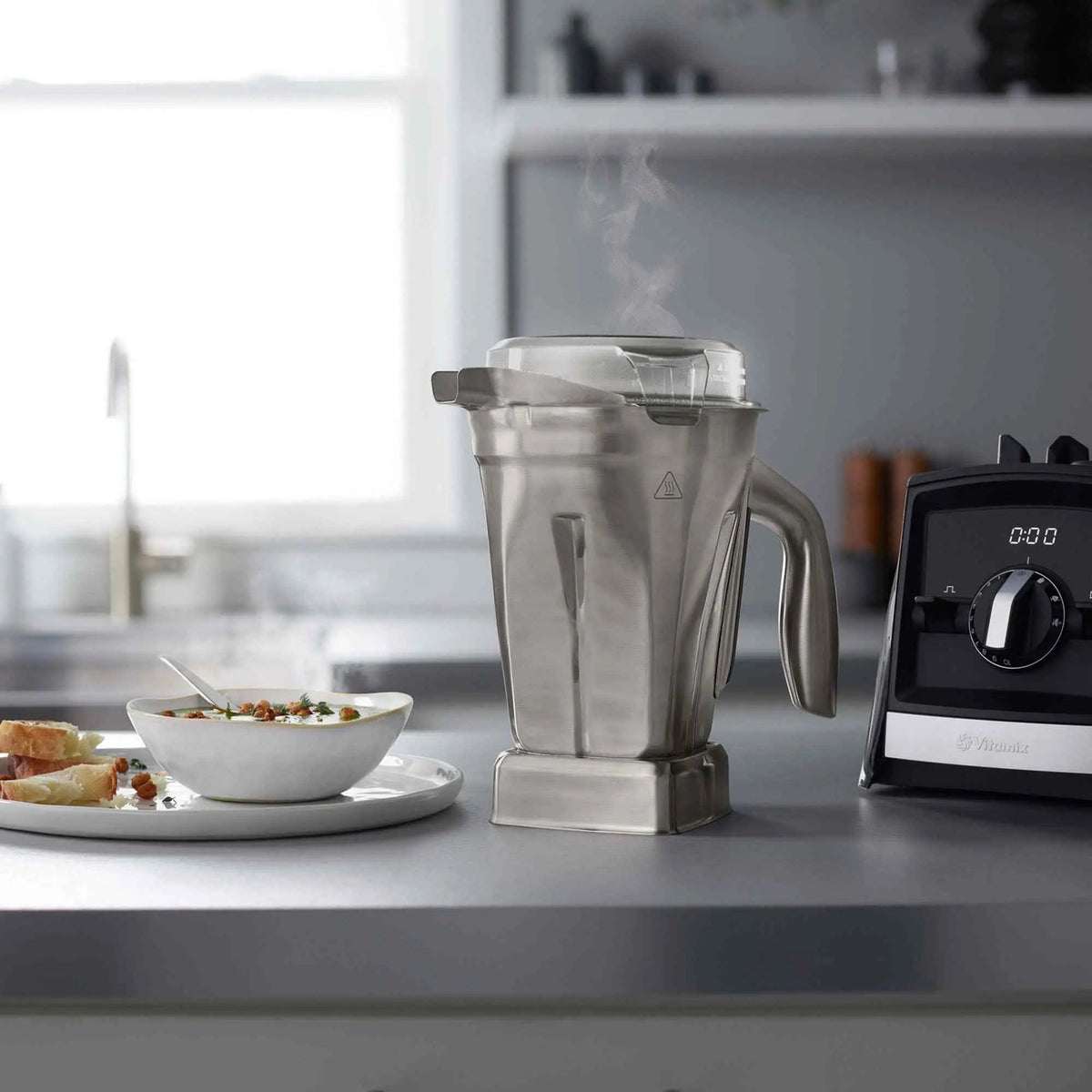 Vitamix Stainless Steel 48oz blender container with BPA-free Tritan lid and dishwasher-safe design